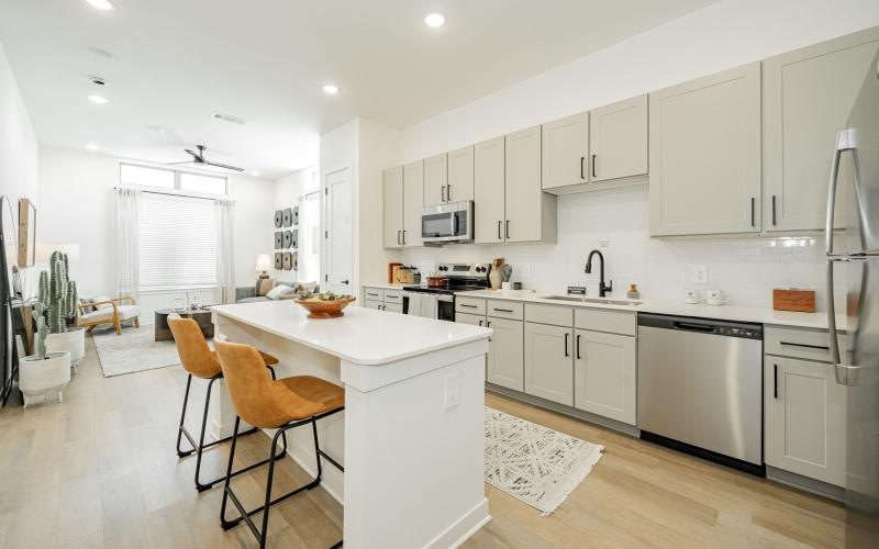 a kitchen with white cabinets