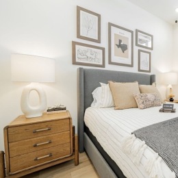 a bedroom with a bed and a nightstand