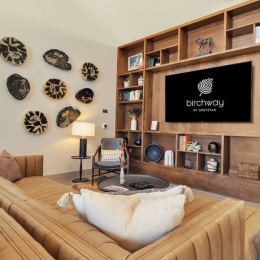 a clubroom with a tv and a couch