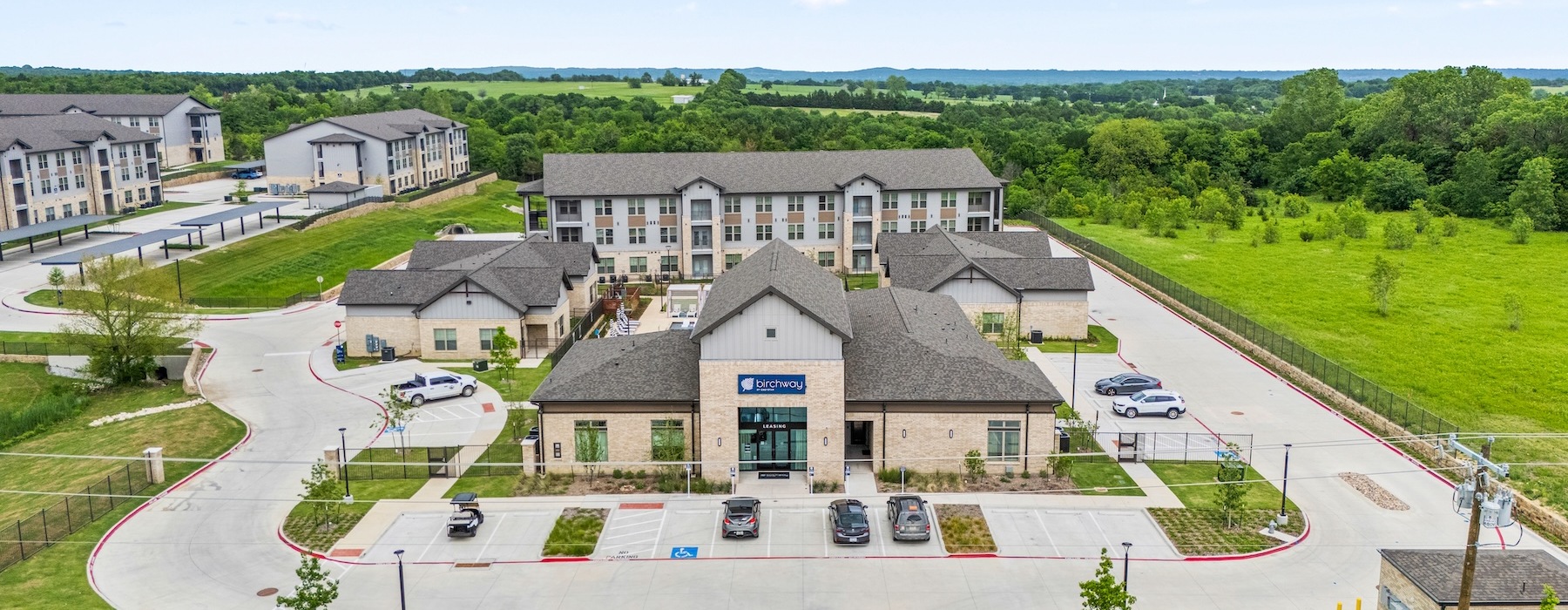 a large building with a parking lot