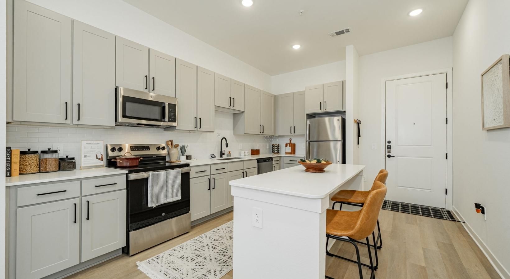 a kitchen with white cabinets