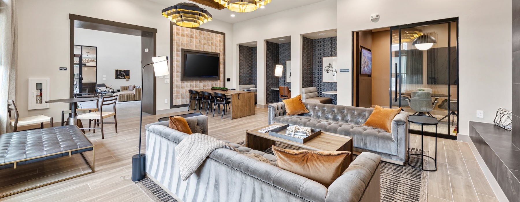 a lounge with couches and a tv