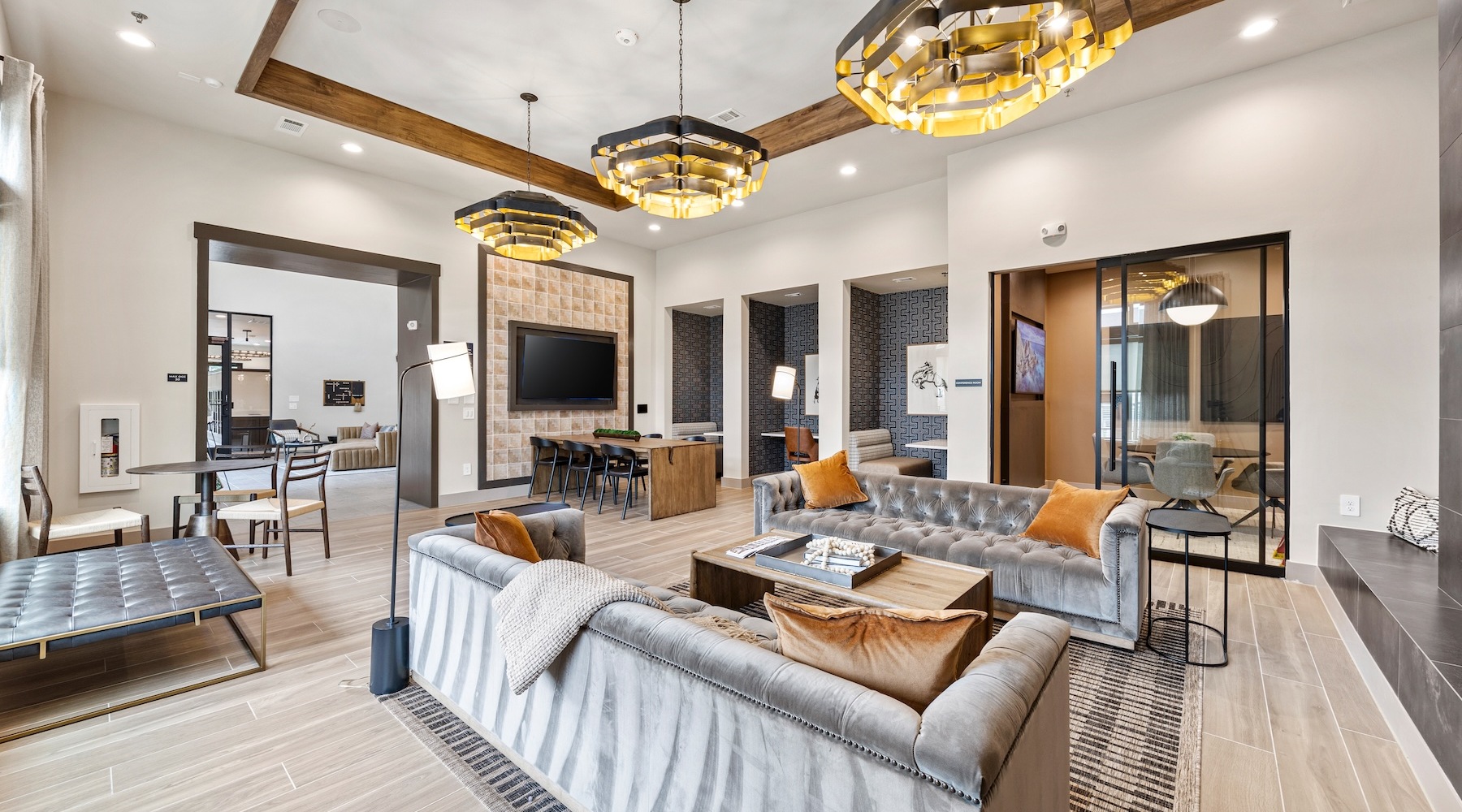 a lounge with couches and a tv