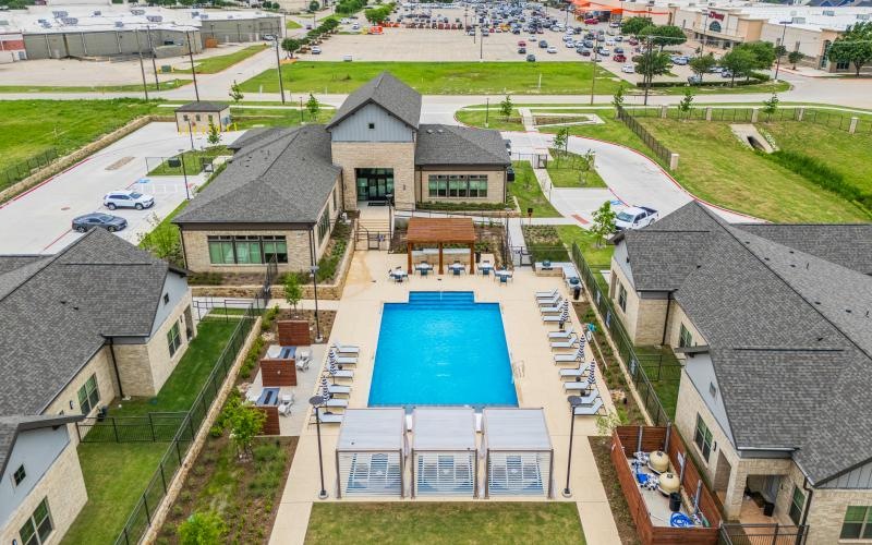 a high angle view of a courtyard with a pool
