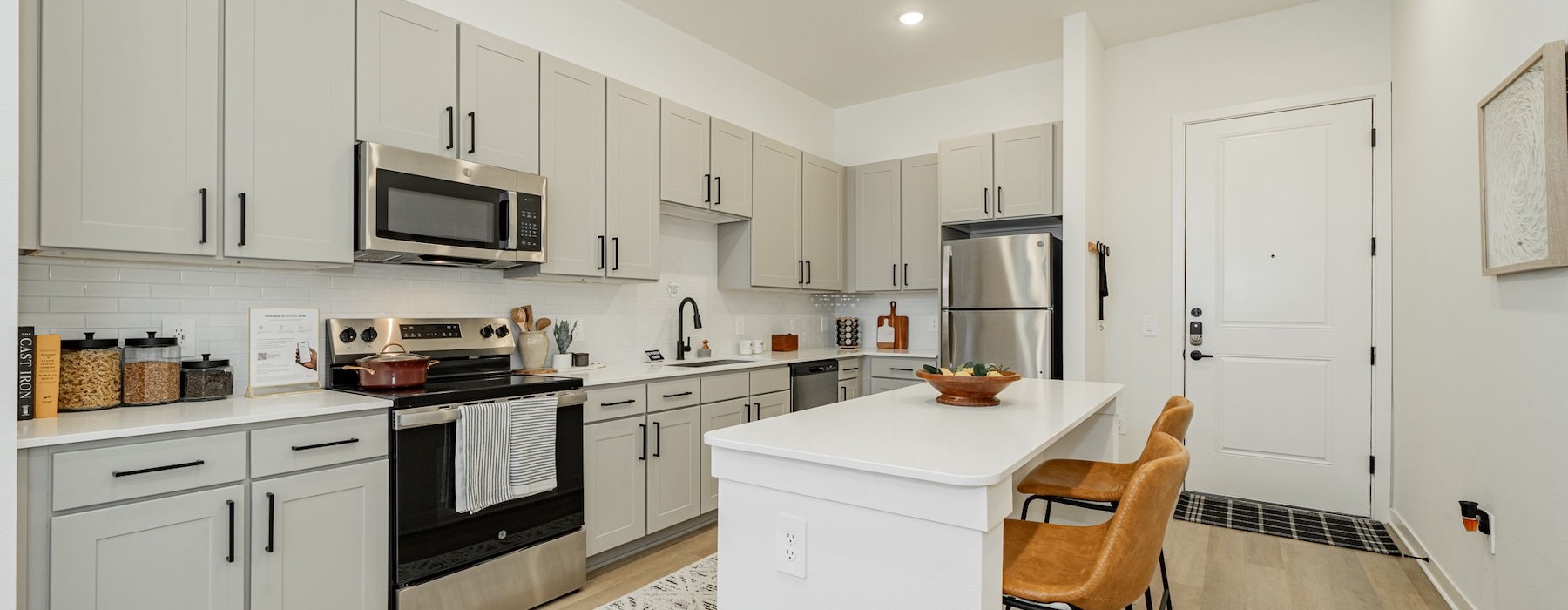 a kitchen with white cabinets
