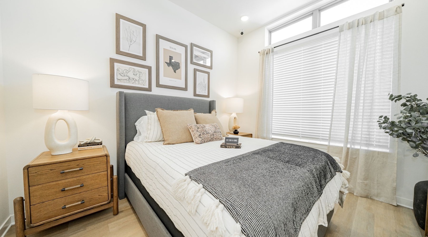 a bedroom with a bed and two nightstands