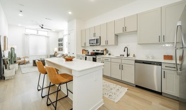 a kitchen with white cabinets